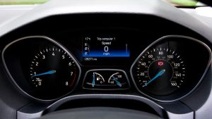 Close-up view of a Ford Focus dashboard showing the speedometer and various gauges.
